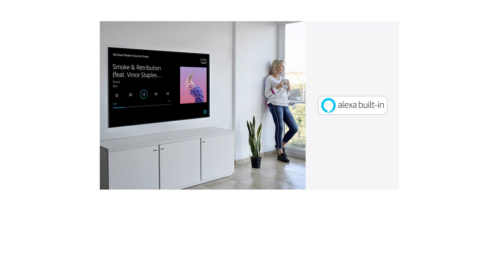 A woman is leaning beside TV, looking out the window and ask alexa about to play her favorite music.