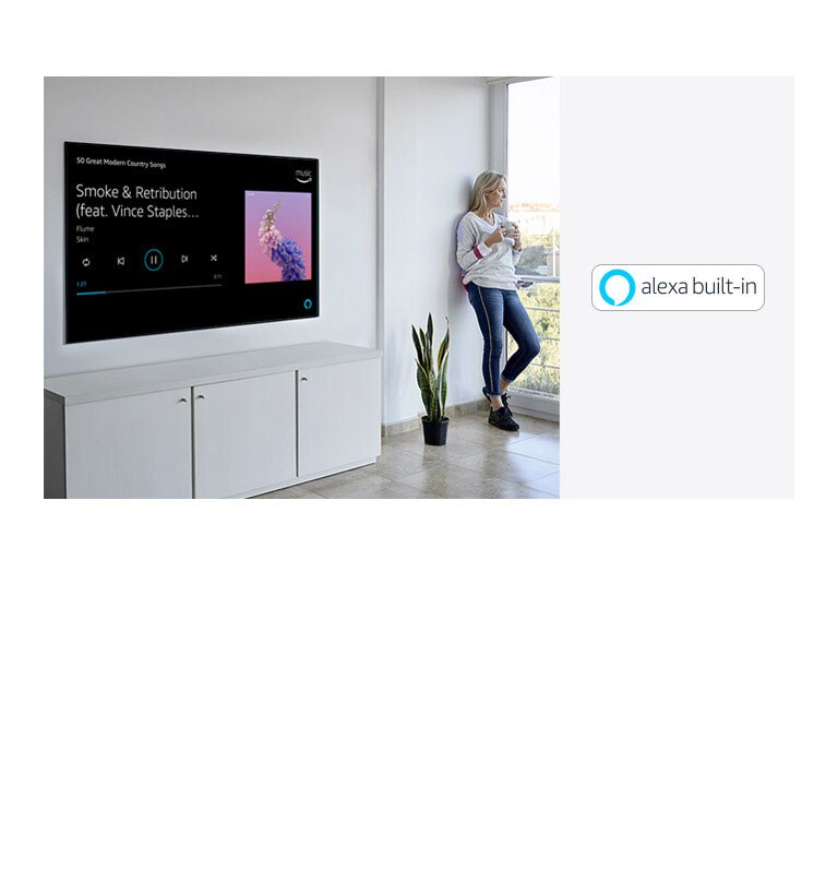 A woman is leaning beside TV, looking out the window and ask alexa about to play her favorite music.