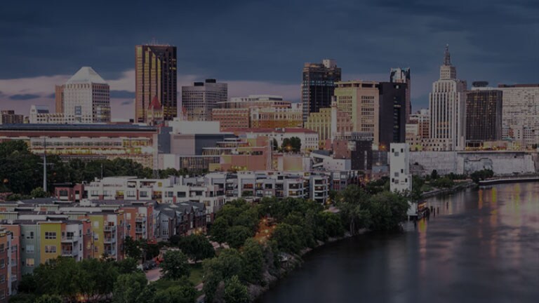 Dull low-resolution cityscape. The alpha 11 AI Processor appears. Different circle icons move around the cityscape showing how the processor is analyzing every element in the frame. The processor pulses with power and the cityscape image is suddenly brighter, more detailed, and with 4K resolution thanks to AI Super Upscaling.