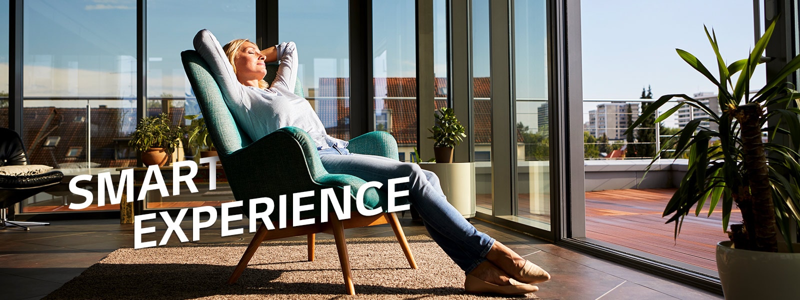 A woman relaxing on a chair in a living room.