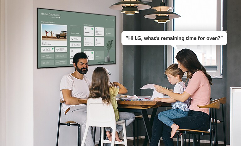 Family sitting at a table with mother asking TV remaining time for the oven.