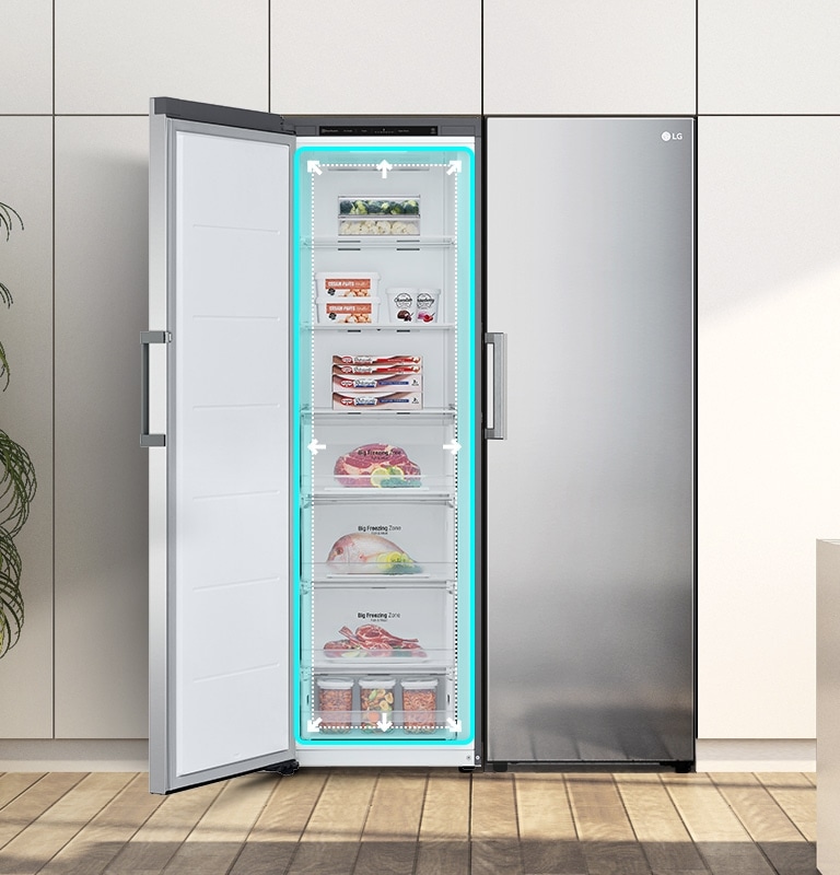 The freezer is shown from the front with the door open and a blue square and arrows pushing out highlighting the ample space inside.