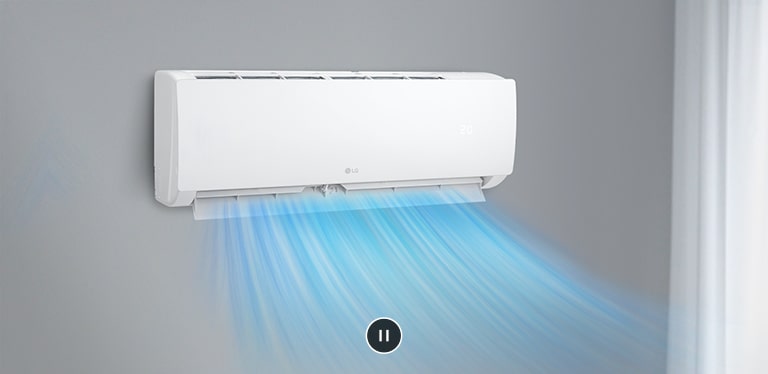 The air conditioner is operating on the wall in the living room and cool air from the air conditioner is spreading out.