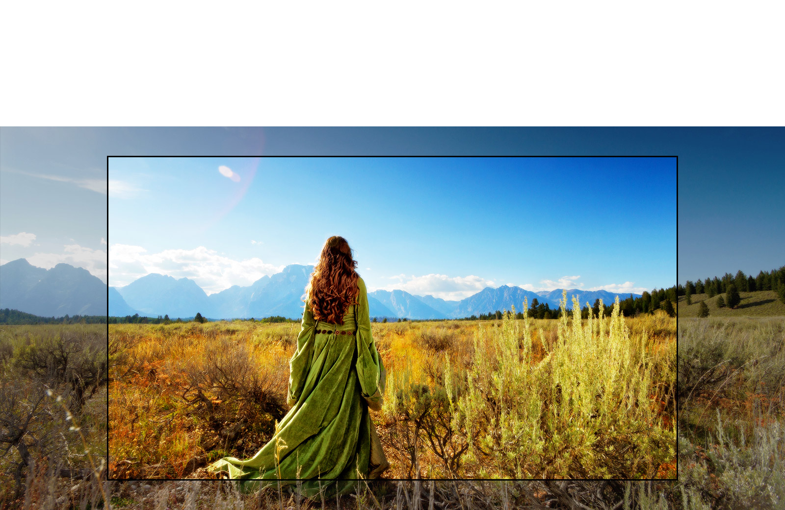 Un écran du téléviseur montrant une scène d’un film fantastique présentant une femme debout dans les champs face aux montagnes.