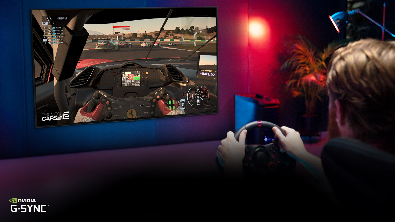 Man sitting on a racer gaming chair, holding a racing wheel while playing a racing game on a TV screen