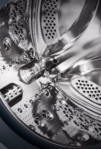 L'image de l'intérieur de la machine à laver où l'on peut voir l’aube en acier inoxydable.