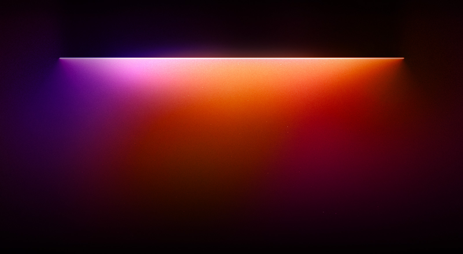 Des lumières de couleurs rouge, orange et violette mettent en valeur le texte « Pour une expérience visuelle et sonore exclusive » écrit en dessous. 