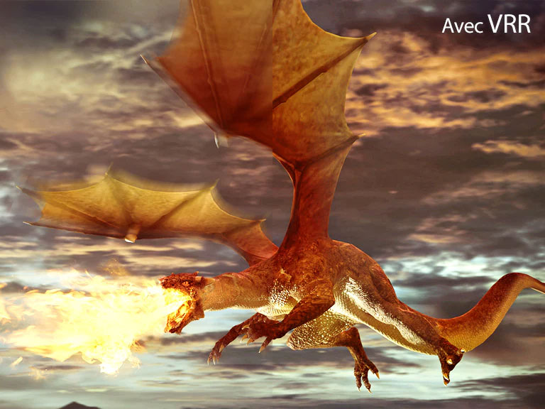 La moitié gauche de la scène, affichant une image floue, est un dragon rouge volant et crachant du feu avec le texte « sans VRR » en haut à gauche. La moitié droite de la scène, affichant une image nette, est un dragon rouge volant et crachant du feu avec le texte « avec VRR » en haut à gauche.