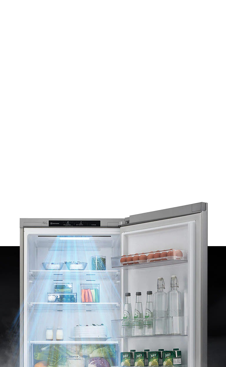 The top half of the refrigerator is shown with the door open. Inside, the shelves are filled with produce and drinks and a gust of wind comes down from the top to cool off the food.