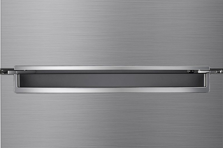 A close up photo of the center of the refrigerator showcasing the elegant and minimalistic handle.