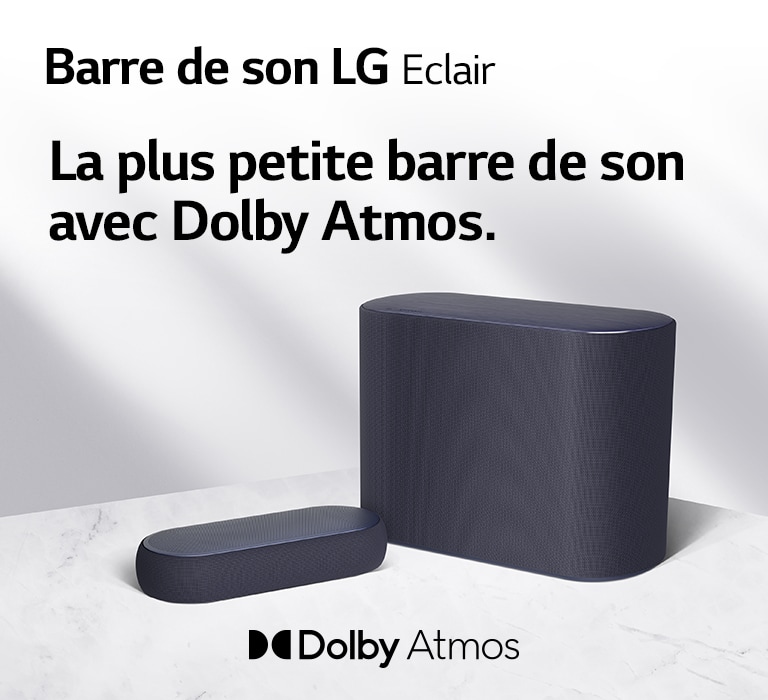 Une barre de son et un caisson de basses sont placés sur un sol en marbre, orientés du côté opposé l’un de l’autre