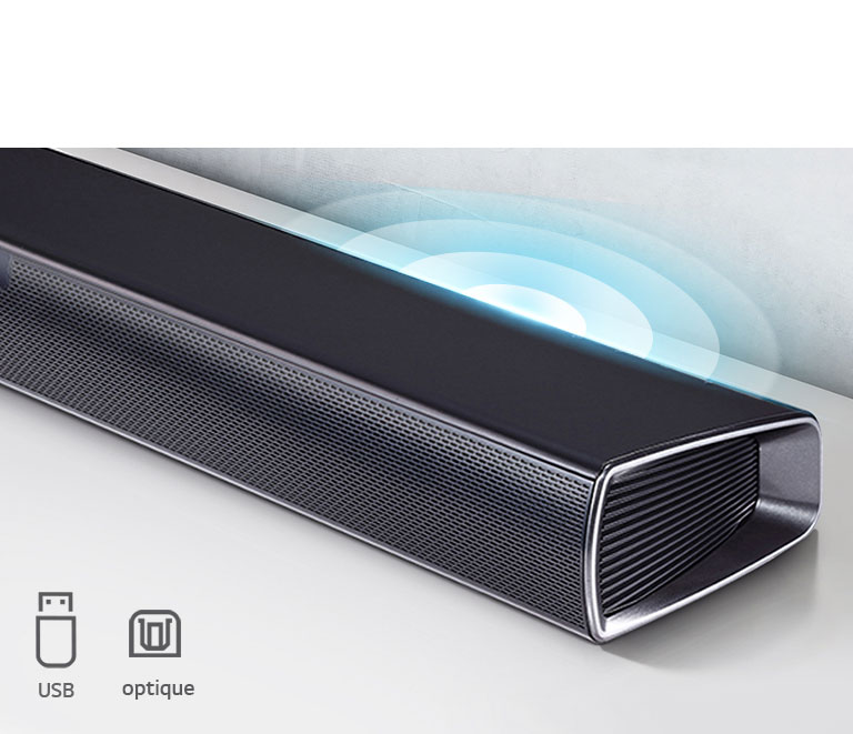 La barre de son LG se trouve sur l’étagère blanche. Graphique représentant du son sortant du haut-parleur. Il met en avant les icônes USB et optiques.
