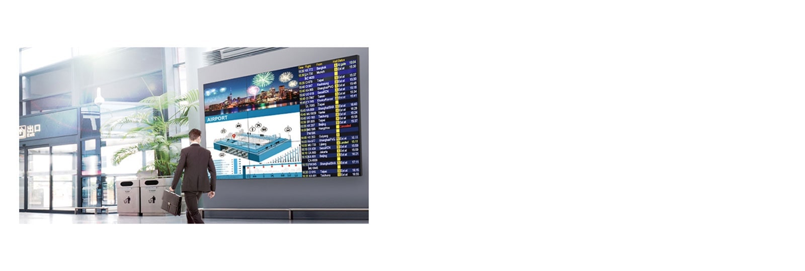  Un hombre pasa mientras mira la pantalla y la pantalla muestra colores vivos desde cualquier ángulo.