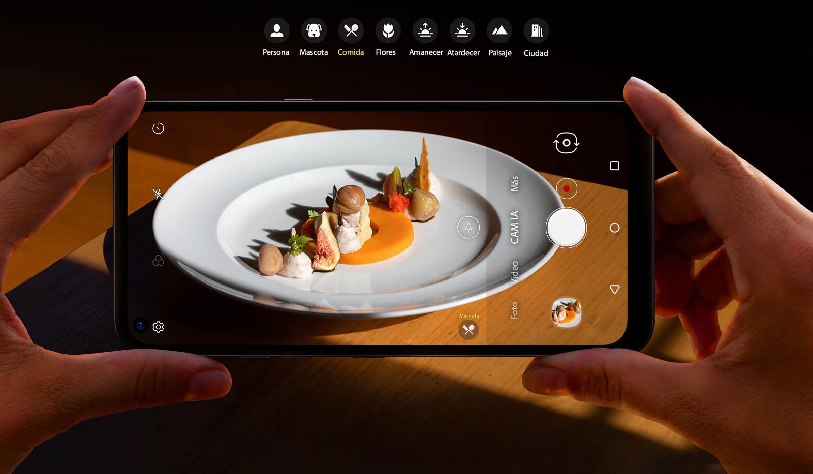Closeup of someone holding a smartphone shooting food
