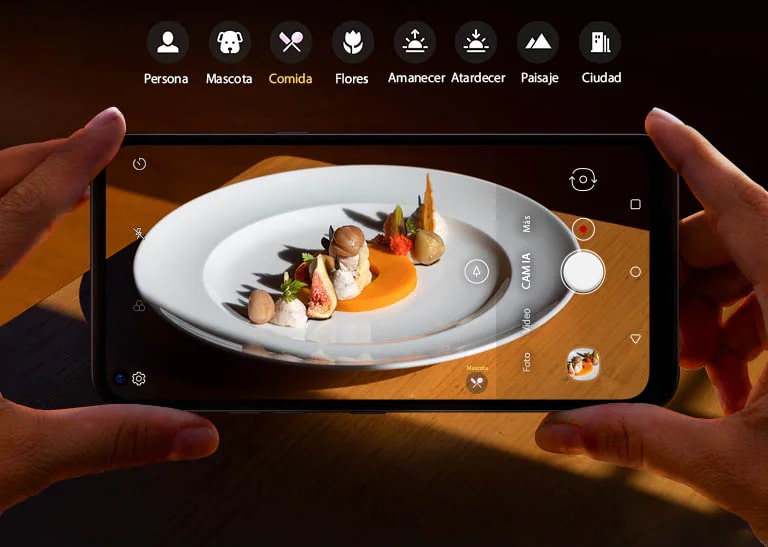 Closeup of someone holding a smartphone shooting food