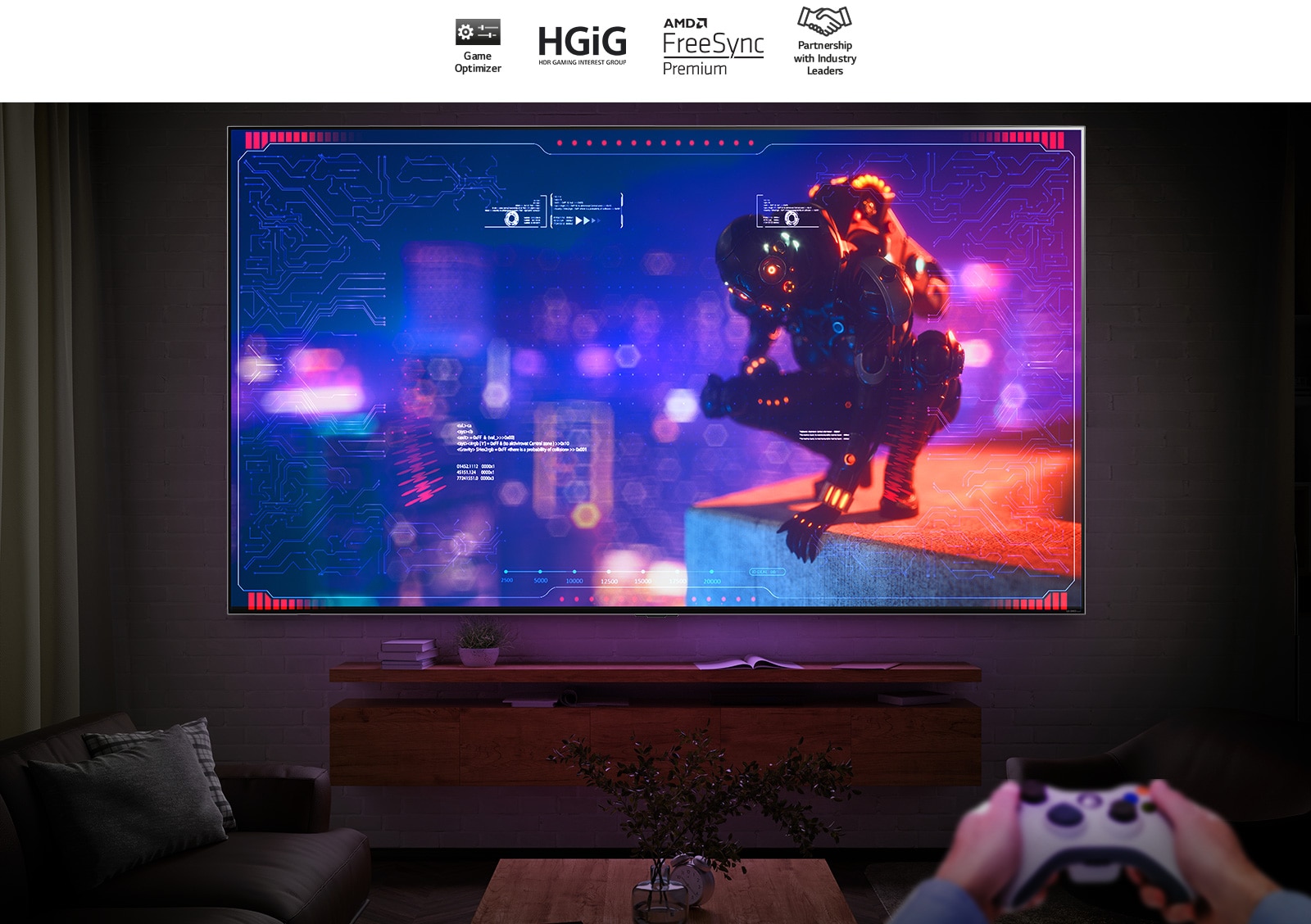 Un televisor ultra grande montado en una pared en una habitación oscura. La pantalla muestra un personaje de ciencia ficción en cuclillas al borde de un edificio. Un par de manos sosteniendo un controlador de juegos en la esquina inferior derecha.