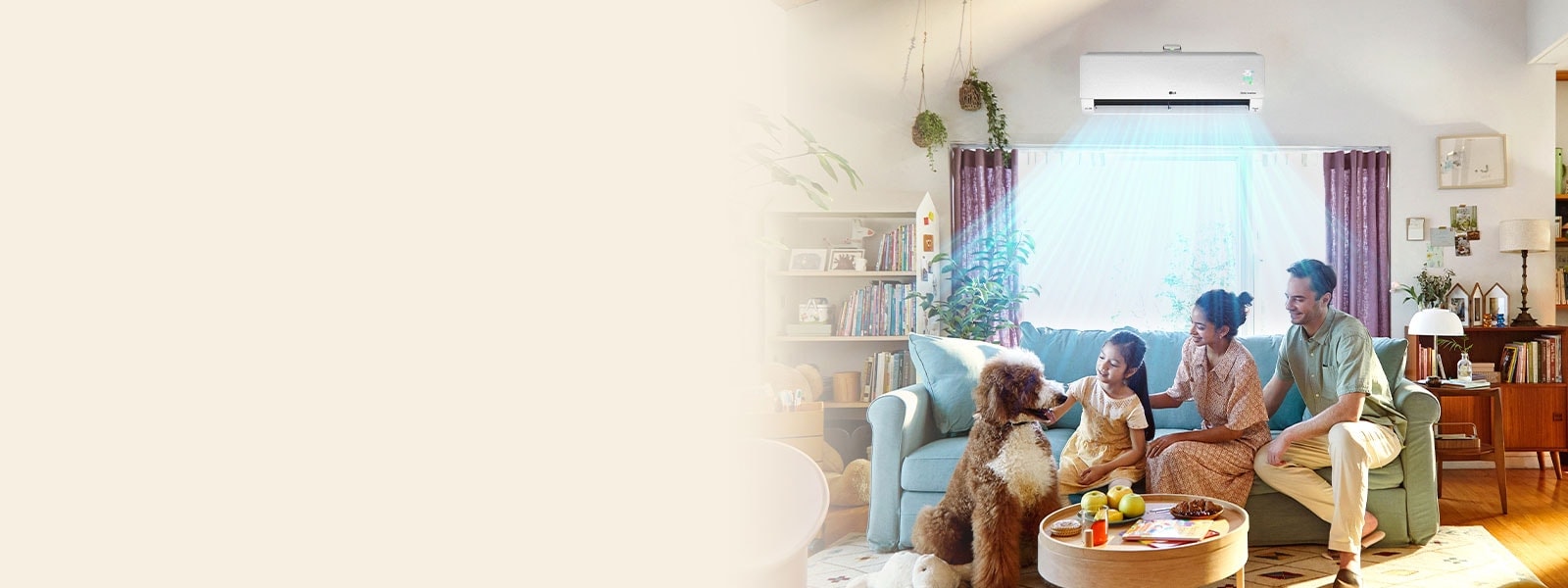 The whole family is sitting on the couch enjoying the cool air conditioner