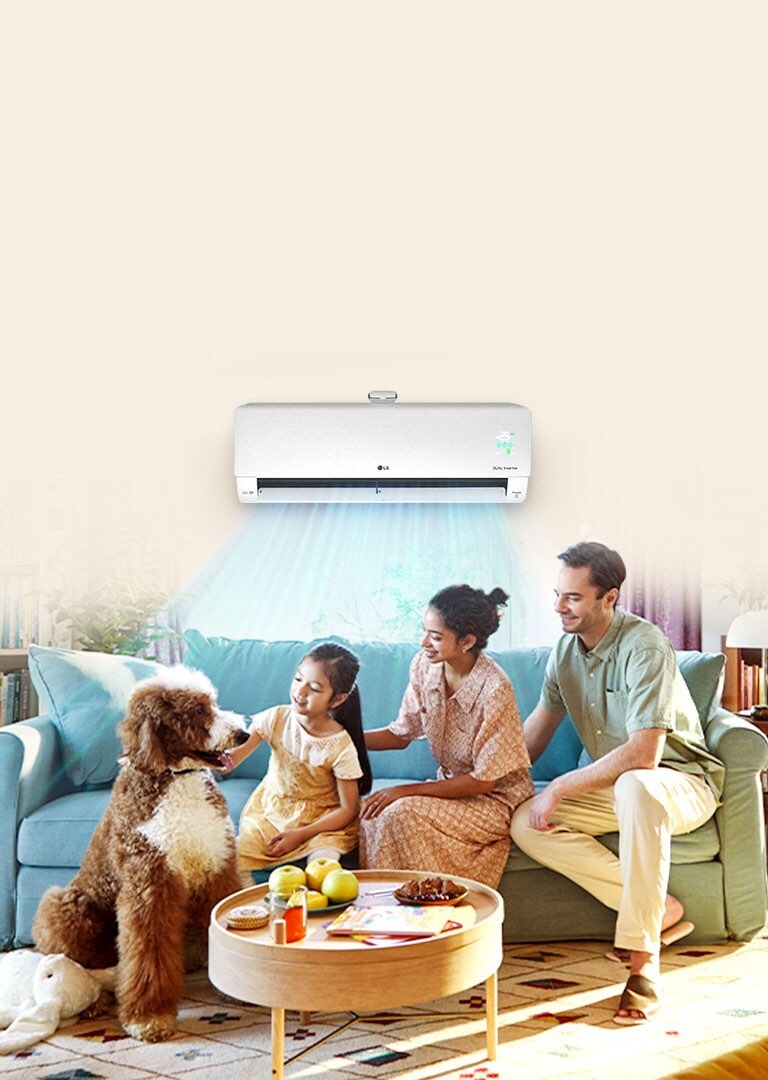 The whole family is sitting on the couch enjoying the cool air conditioner