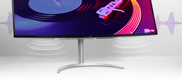 Muestra dos altavoces estéreo de 10 W con graves intensos en la parte inferior del monitor.