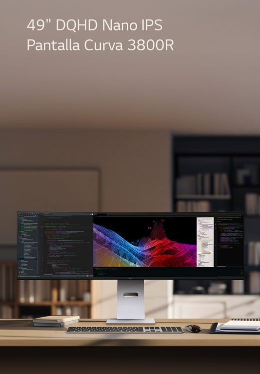 A modern home office setup featuring a large ultra-wide LG monitor displaying data dashboards and graphs, with a wireless keyboard and mouse on a wooden desk.	