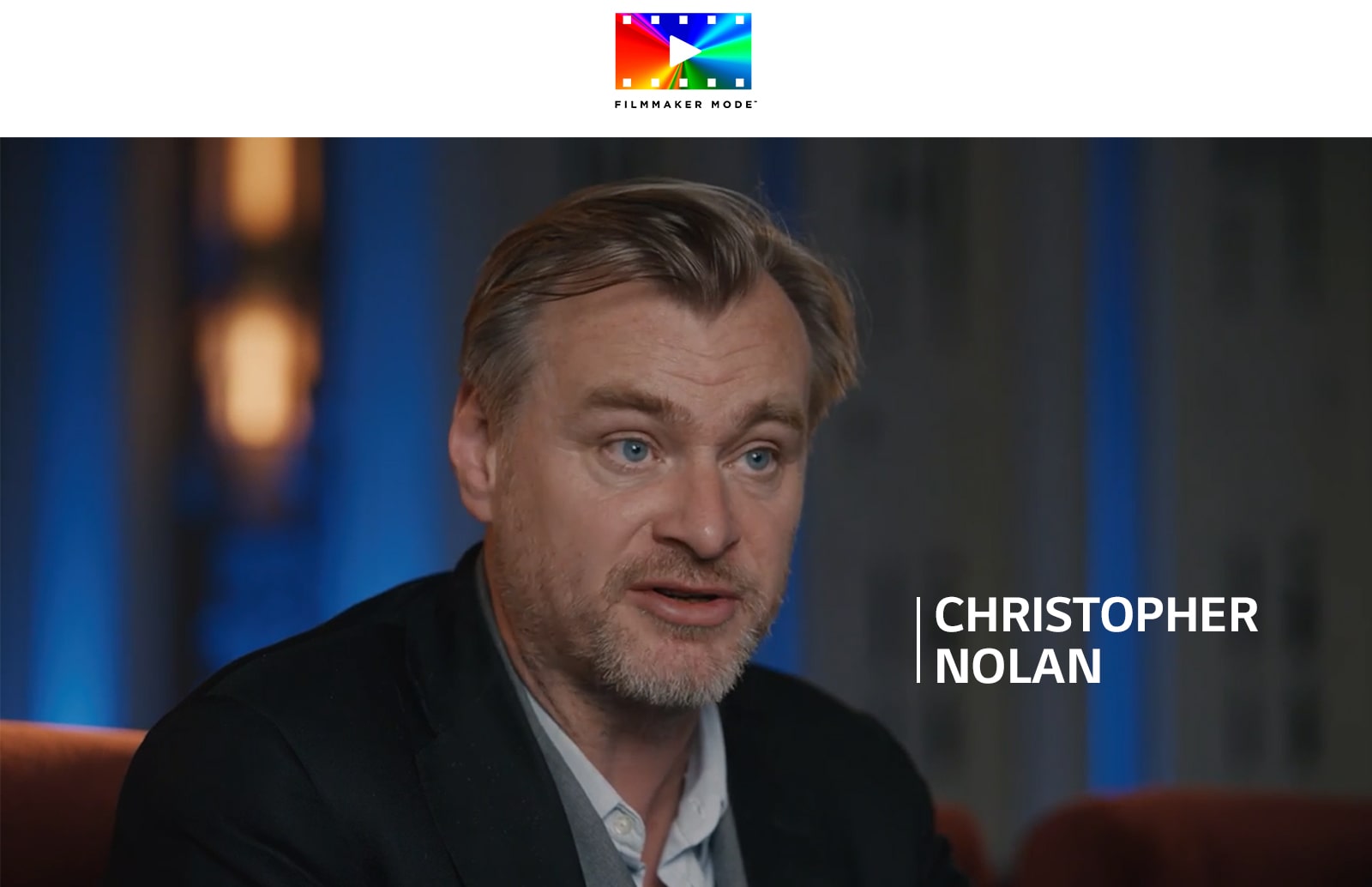 Un logo de FILLMAKER MODE™. Debajo del logo, Christopher Nolan es entrevistado en una habitación oscura.