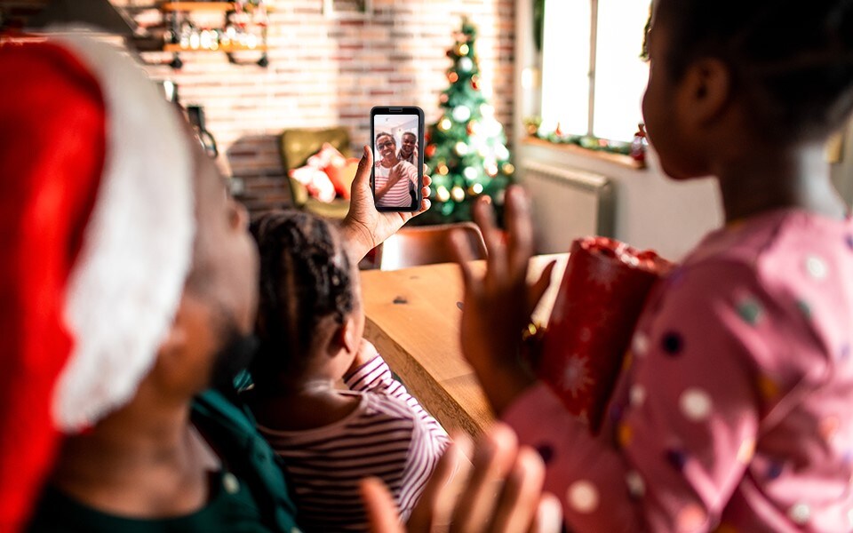 A family video calling someone for Christmas on an LG smartphone 