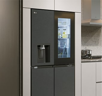 Modern kitchen interior with InstaView fridge.