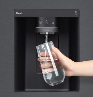 Filling glass with water from the refrigerator dispenser built into the door