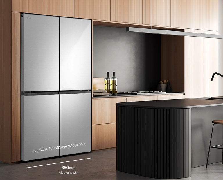 Modern kitchen interior with stainless fridge.