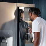 Thumbnail of Lewis Hamilton knocking on the LG SIGNATURE Refrigerator instaview door.