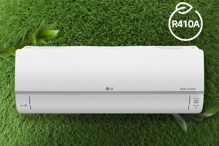The LG Air conditioner is installed on a wall of grass. The R410A logo for energy efficiency is in the upper right corner.