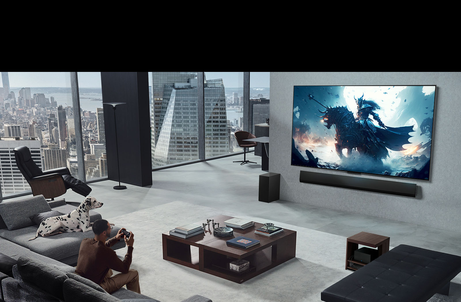 Living room with a person playing a video game on his wall-mounted LG True Wireless TV and LG Soundbar. He holds a controller in his hand, but the gaming console is not immediately visible. There are also no visible wires. The Zero Connect Box is tucked away, barely seen under a side table.