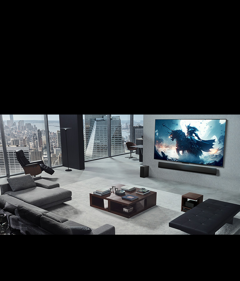 Living room with a person playing a video game on his wall-mounted LG True Wireless TV and LG Soundbar. He holds a controller in his hand, but the gaming console is not immediately visible. There are also no visible wires. The Zero Connect Box is tucked away, barely seen under a side table.