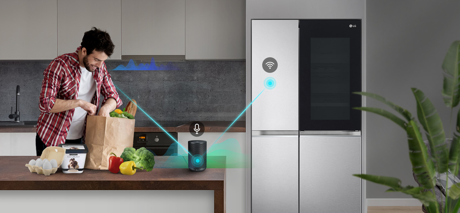 A man stands in a kitchen unloading produce from a grocery bag and speaks, shown by volume bars moving up and down near him, to the AI speaker on the counter telling it to "turn on express freeze". A line appears that goes from the man to the AI speaker which has a microphone icon above it. Then volume bars show up near the AI speaker and a line appears from the AI speaker to the refrigerator which has a Wifi icon above it.