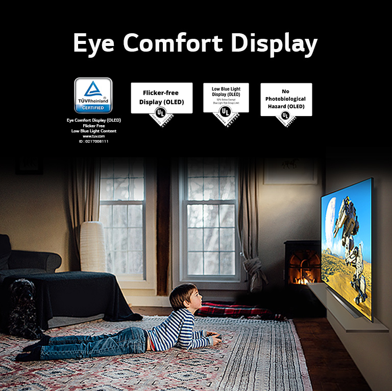 A side view of a boy laying down and watching a TV, labeled "Eye Comfort Display"