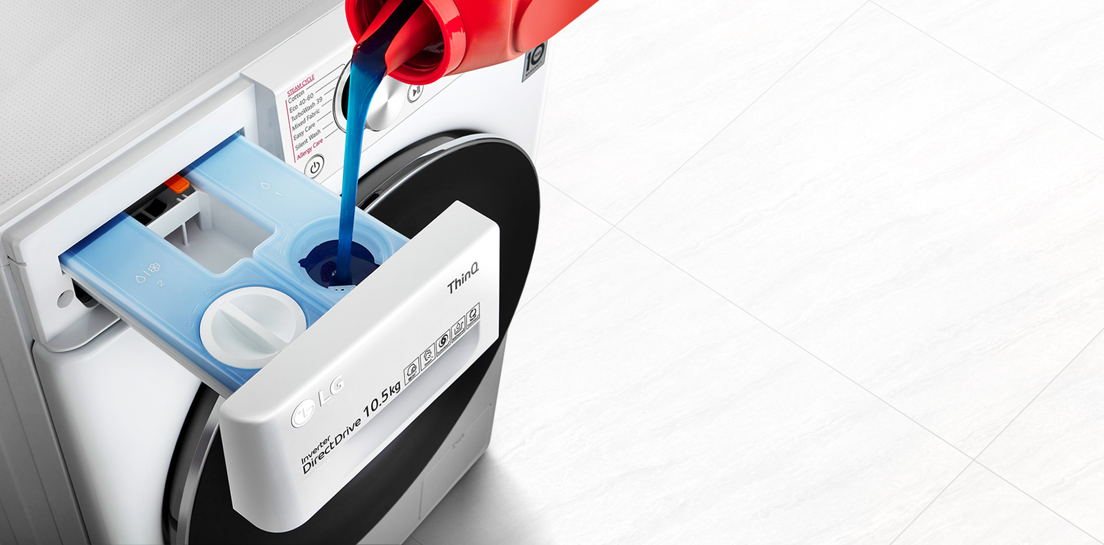 Detergent is pouring into the washing machine's detergent container.