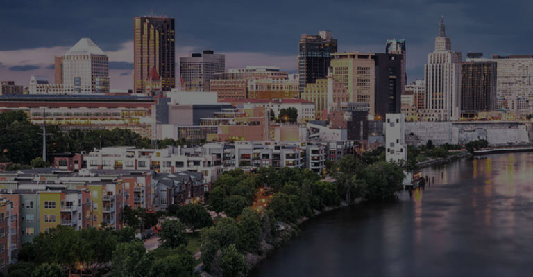 Dull low-resolution cityscape. The alpha 11 AI processor appears. Different circle icons move around the cityscape showing how the processor is analyzing every element in the frame. The processor pulses with power and the cityscape image is suddenly brighter, more detailed, and with 4K resolution thanks to AI Super Upscaling.