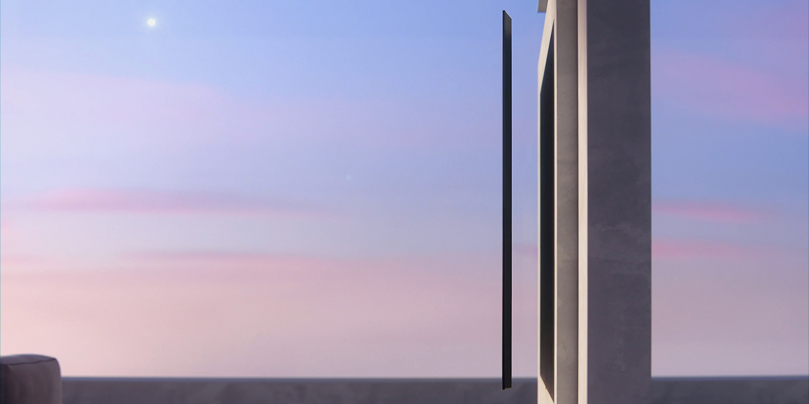 A side view of a slim design TV that is about to be hung on the wall.