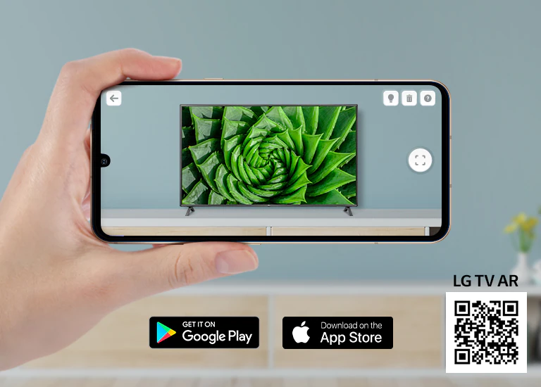 A person using LG TV AR app on a phone and a QR code which links to LG TV AR(http://www.lgtvism.com/lgtvar)