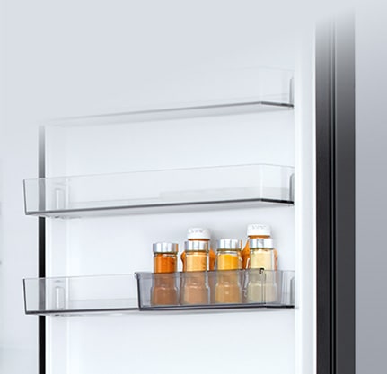 LG bottom freezer (GBBW726AEV) interior with transparent sliding mini door basket holding six small sauce bottles