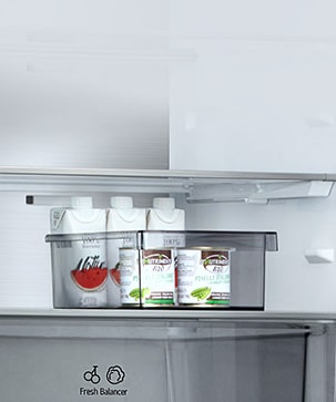 LG bottom freezer (GBBW726AEV) interior with movable bucket holding juice packs and container placed above Fresh Balancer drawer