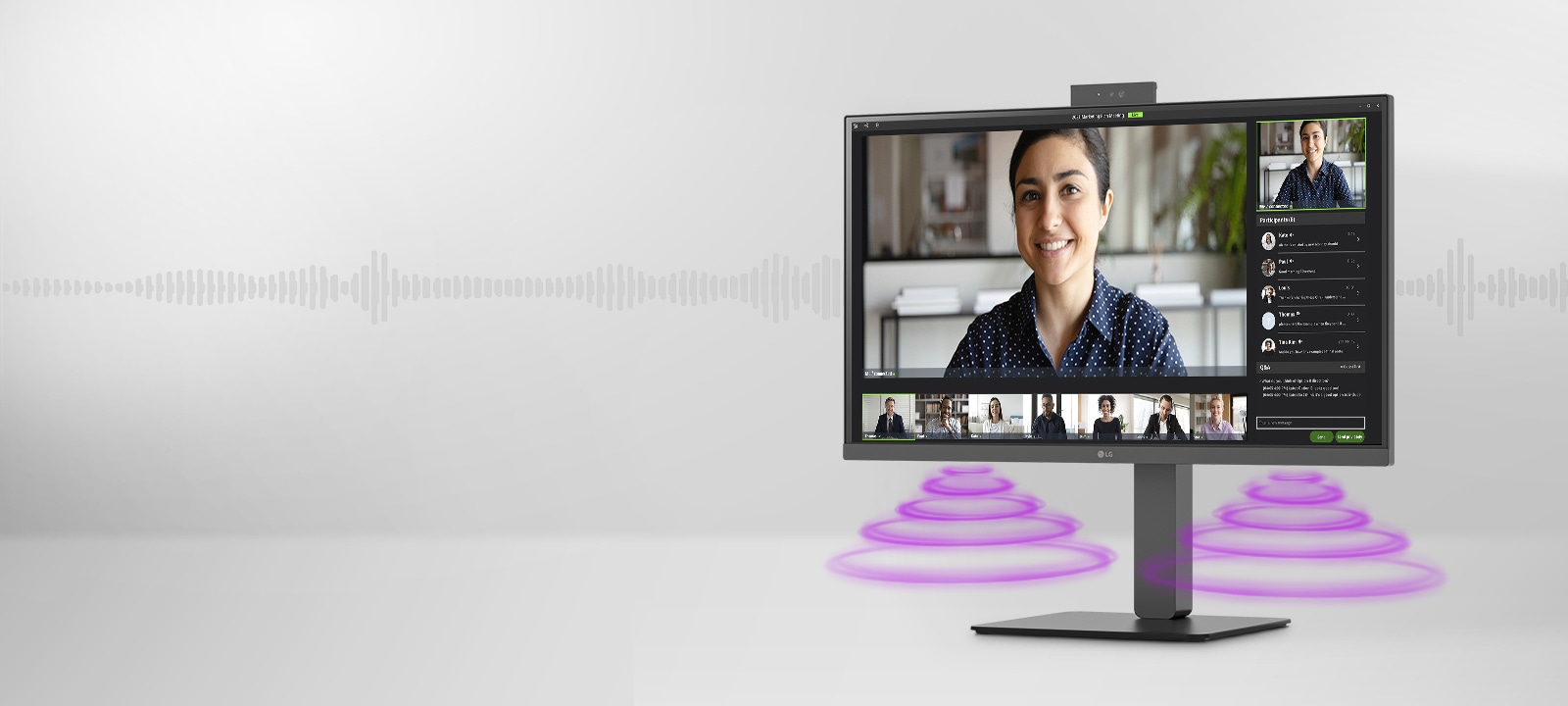 Vue latérale montrant une scène de vidéoconférence sur le moniteur.