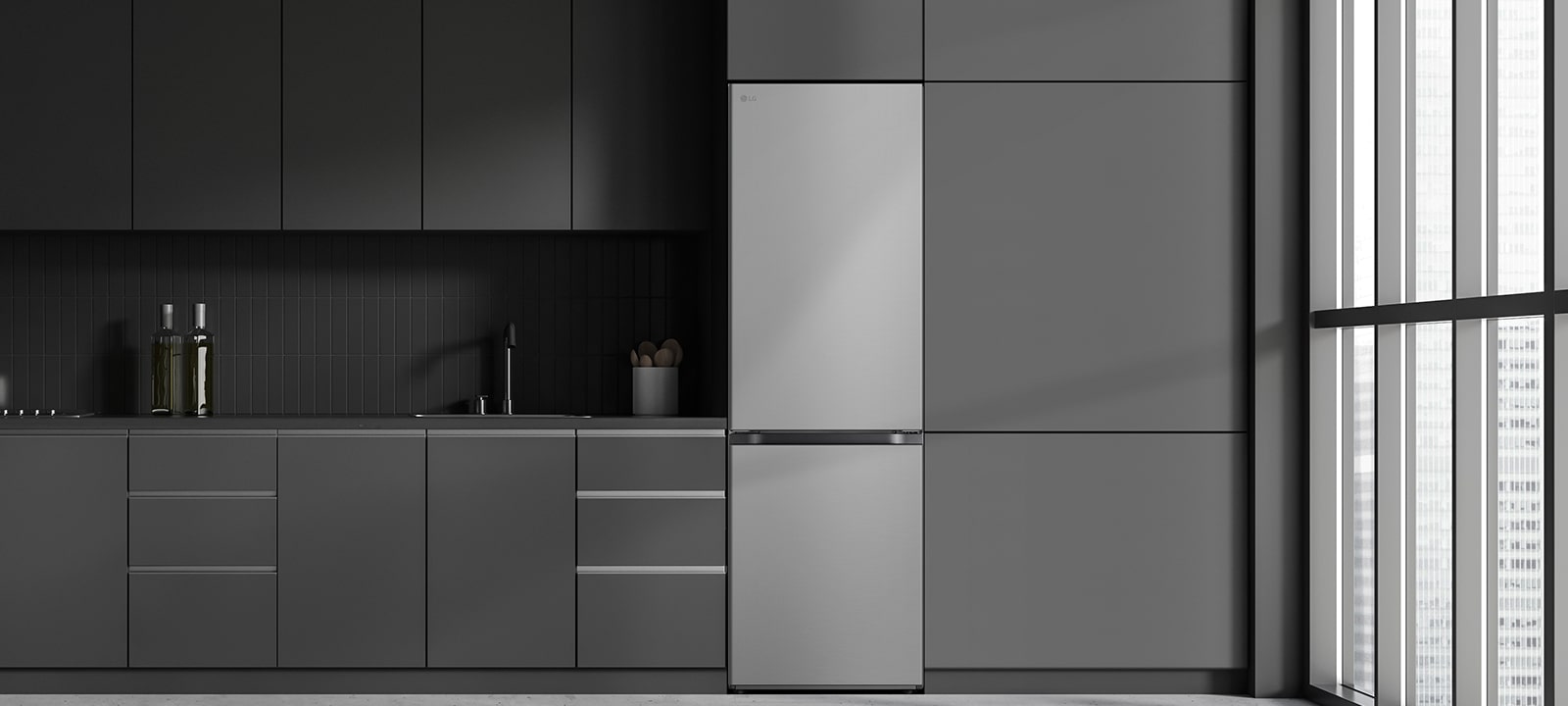 Cuisine moderne avec un réfrigérateur qui s’insère parfaitement dans les armoires, tout comme un modèle encastré.