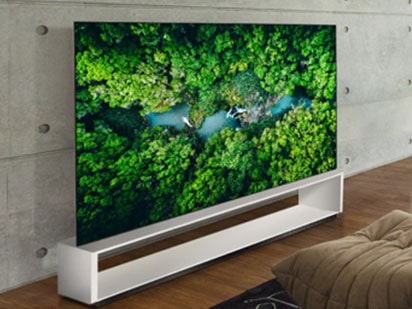 A curved OLED screen installation reading "LG OLED"