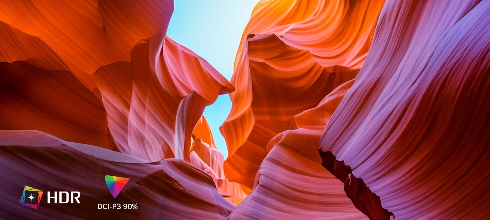 L’écran continent différentes couleurs représentant l’UHD 4K, et dans le coin en bas à gauche, on voit un logo indiquant HDR et DCI-P3 90 %.	