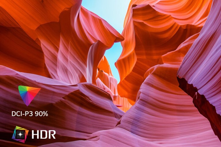 L’écran continent différentes couleurs représentant l’UHD 4K, et dans le coin en bas à gauche, on voit un logo indiquant HDR et DCI-P3 90 %.	