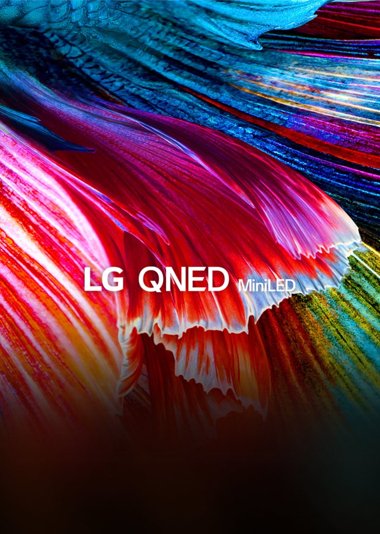 Gros plan sur des vagues aux couleurs vives dans des tons rouges, bleus, verts et jaunes.