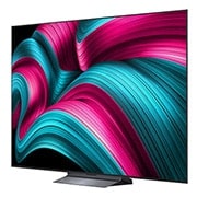 LG Smart TV LG OLED evo AI 4K C5 2025 83 pouces, Écran LG TV avec une télécommande AI Magic Remote au premier plan. Le bouton IA est mis en surbrillance et une bulle de dialogue montre du texte : suggérez un film que j’aime. À l’écran, nous voyons l, OLED83C54LA, thumbnail 4