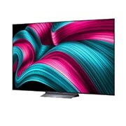 LG Smart TV LG OLED evo AI 4K C5 2025 83 pouces, Espace salon avec une LG OLED TV à fixation murale. Sur la TV se trouve une chaîne de montagnes face à un ciel sombre et nocturne rempli d’étoiles. Cette scène est divisée en deux pour montrer comment, OLED83C54LA, thumbnail 5