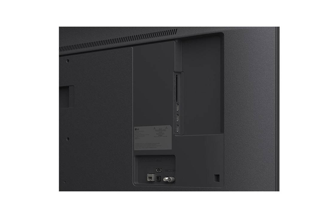 LG Smart TV LG UHD AI UA75 4K 2025 65 pouces, LG TV avec un écran d’une taille impressionnante fixé sur un mur au-dessus d’une LG Soundbar dans un salon au style moderne., 65UA75006LA, thumbnail 9